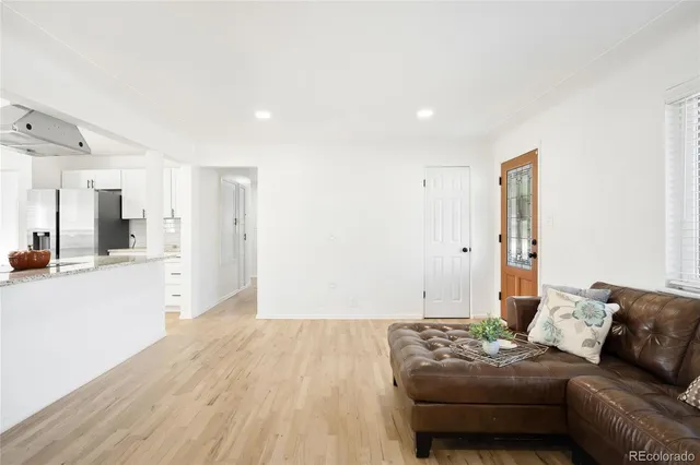 a bedroom with furniture and a wooden floor