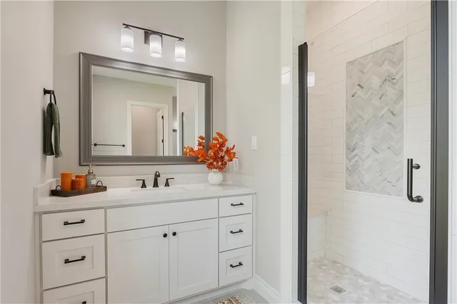 a bathroom with a double vanity sink and mirror