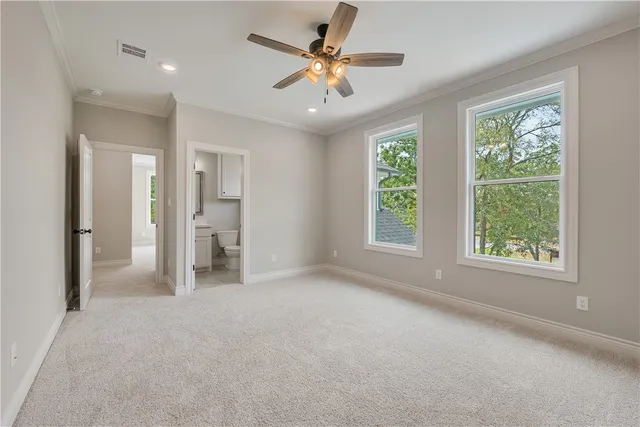 a view of a livingroom with a ceiling fan and window