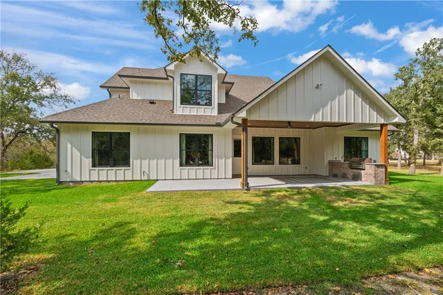 a front view of a house with a garden and porch