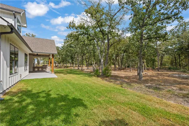 a view of a street with houses on both side