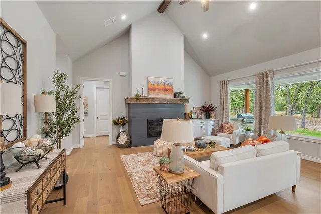a living room with furniture and a fireplace