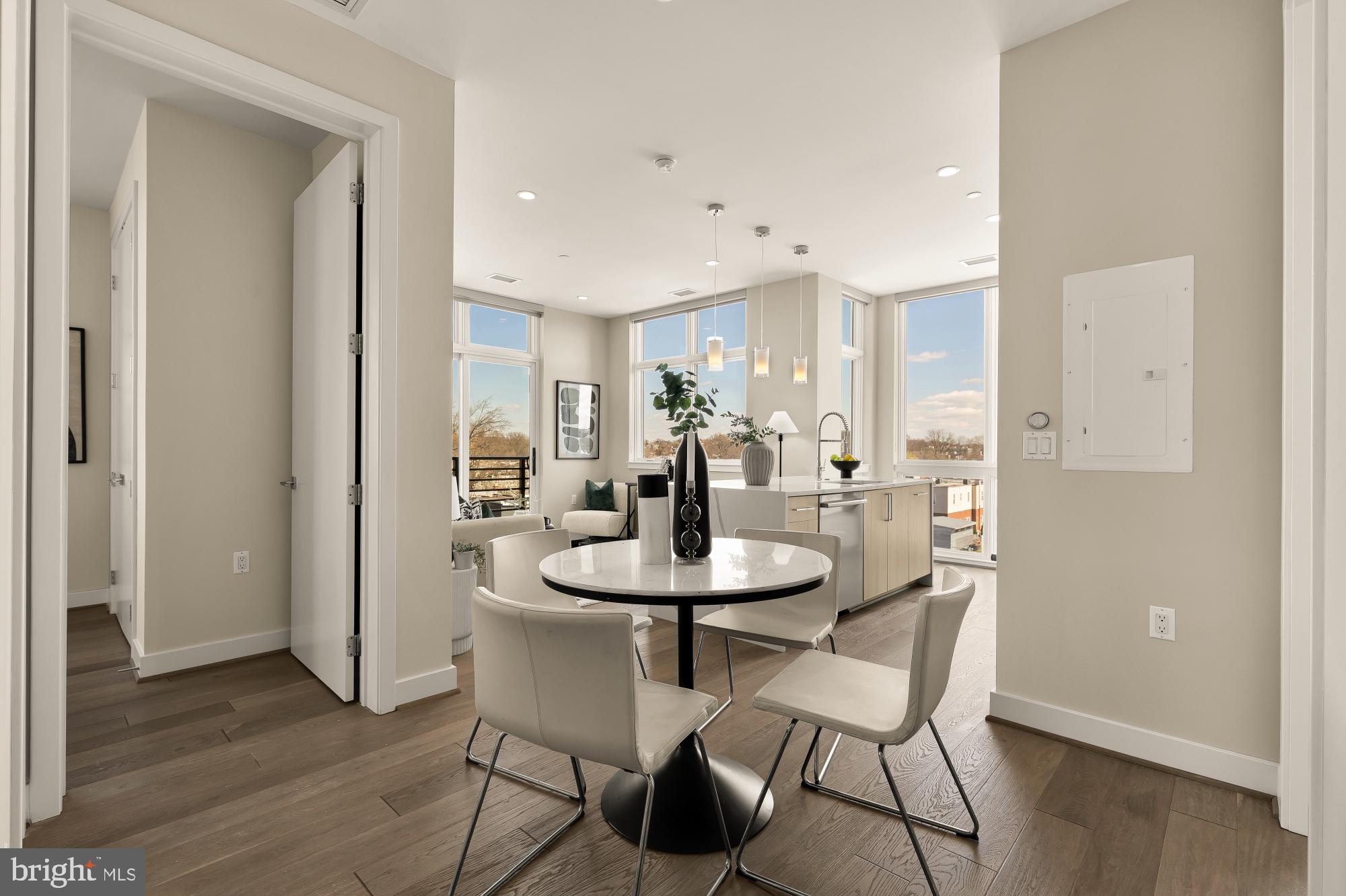 646 H Street Northeast, Unit 503 Washington, DC 20002 - Photo 5 of 26 a view of a dining room with furniture and wooden floor