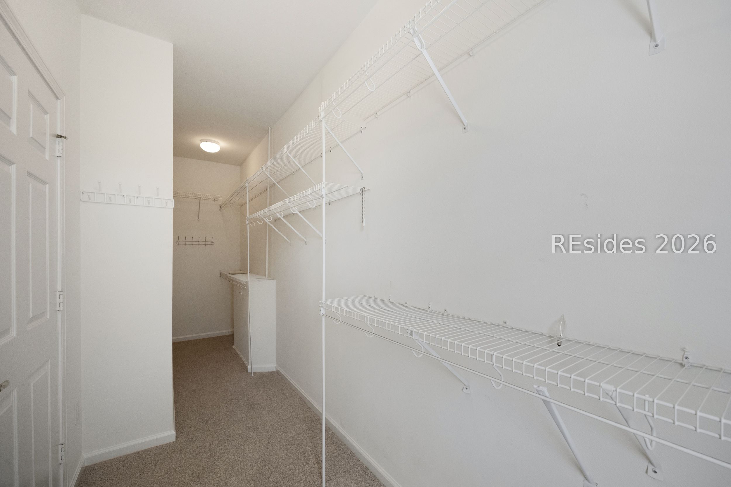 149 Hampton Circle Bluffton, SC 29909 - Photo 14 of 27 Primary Bedroom Walk-in Closet