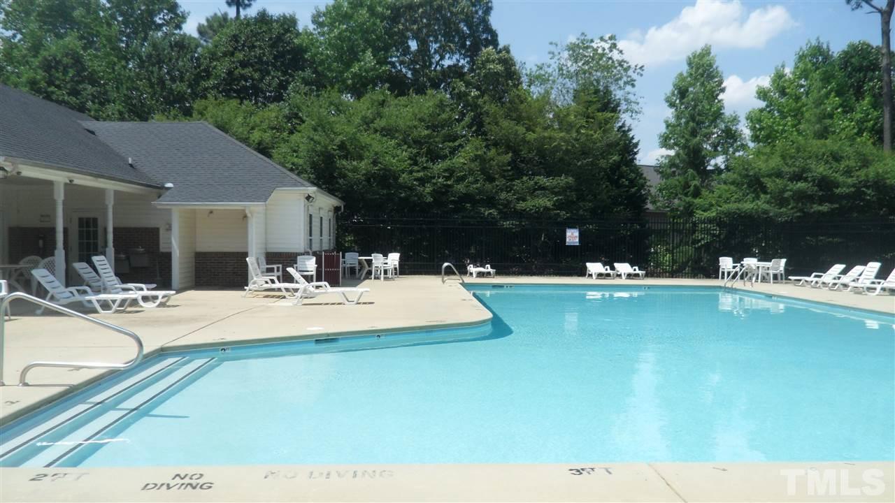 2830-102 Barrymore Street, Unit 102 Raleigh, NC 27603 - Photo 11 of 15 a view of a swimming pool with lounge chair