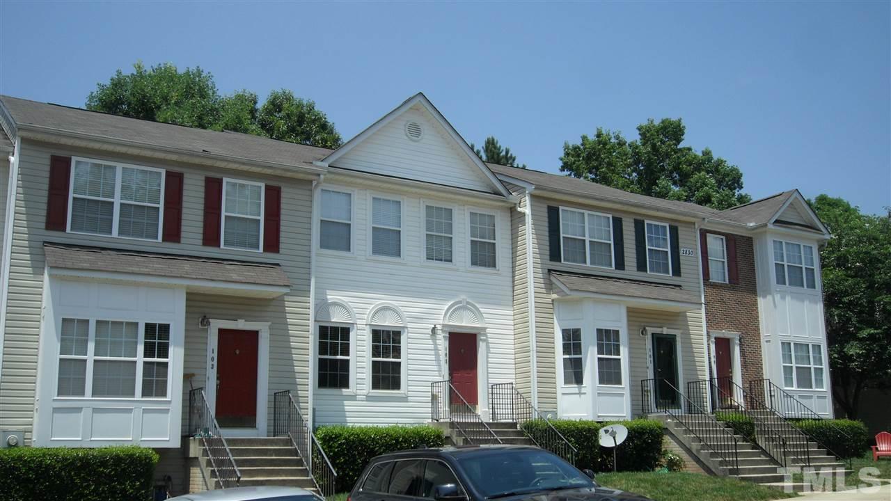 2830-102 Barrymore Street, Unit 102 Raleigh, NC 27603 - Photo 15 of 15 a front view of a house with a yard