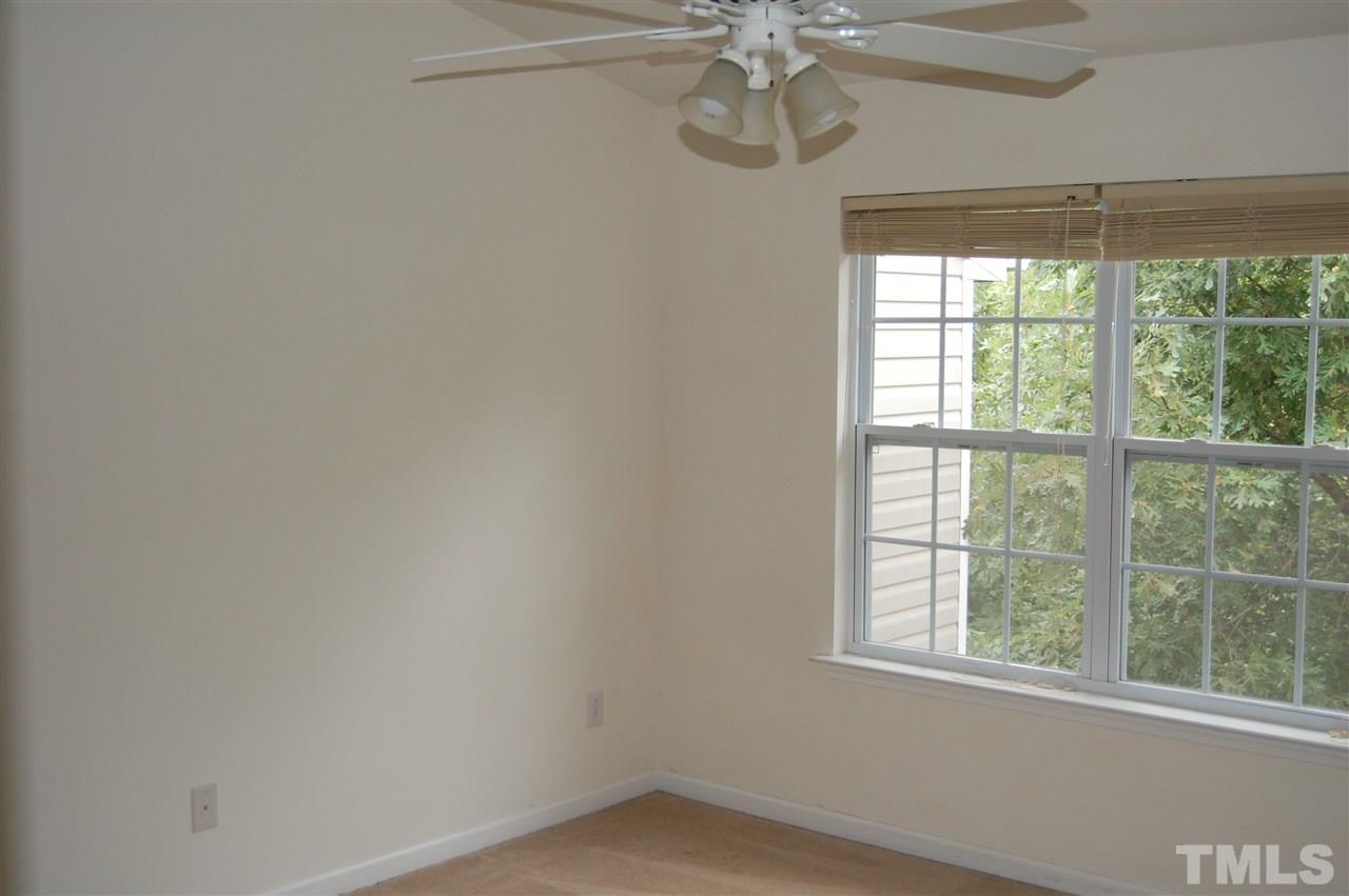 2830-102 Barrymore Street, Unit 102 Raleigh, NC 27603 - Photo 6 of 15 an empty room with a window