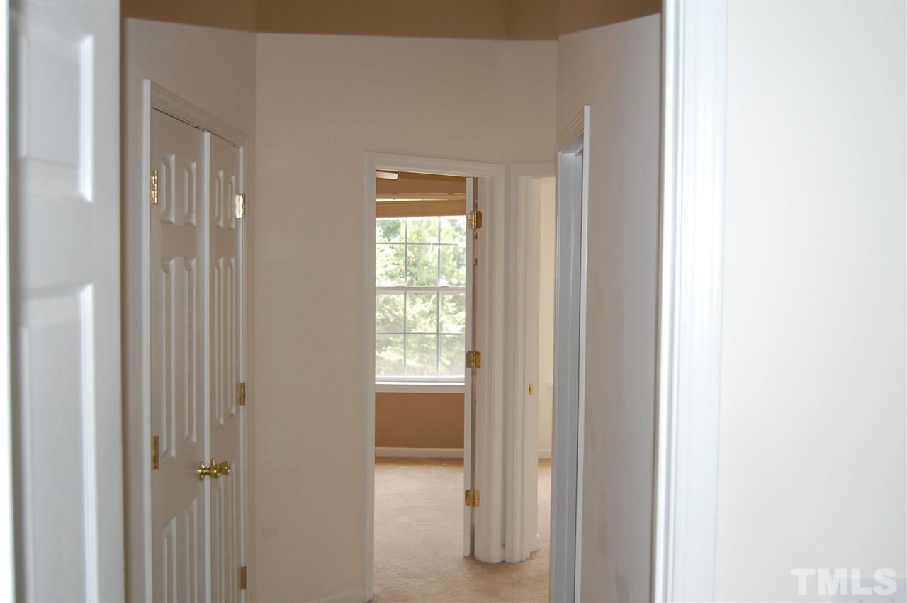 2830-102 Barrymore Street, Unit 102 Raleigh, NC 27603 - Photo 8 of 15 a view of an empty room with a closet