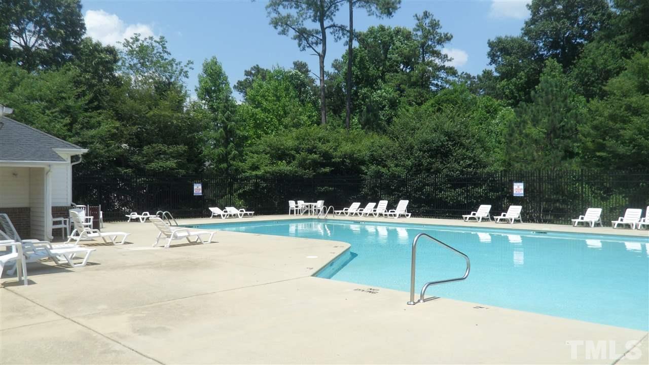 2830-102 Barrymore Street, Unit 102 Raleigh, NC 27603 - Photo 10 of 15 a view of a swimming pool with a patio