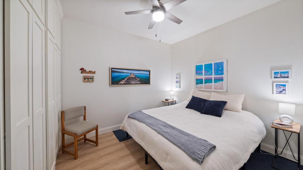 1211 VZ County Road Canton, TX 75103 - Photo 22 of 39 a bedroom with a bed and a chandelier