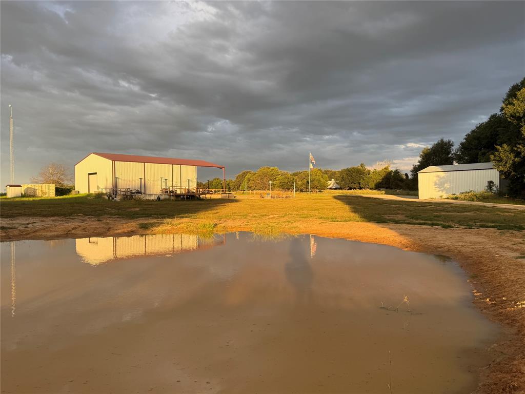 1211 VZ County Road Canton, TX 75103 - Photo 5 of 39 a view of a swimming pool with an outdoor space and seating area