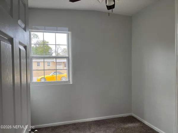 an empty room with windows