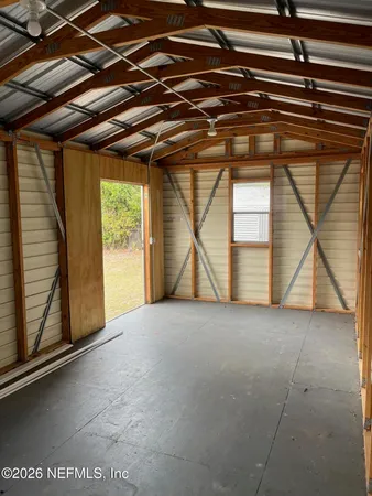 a view of a room with a large window