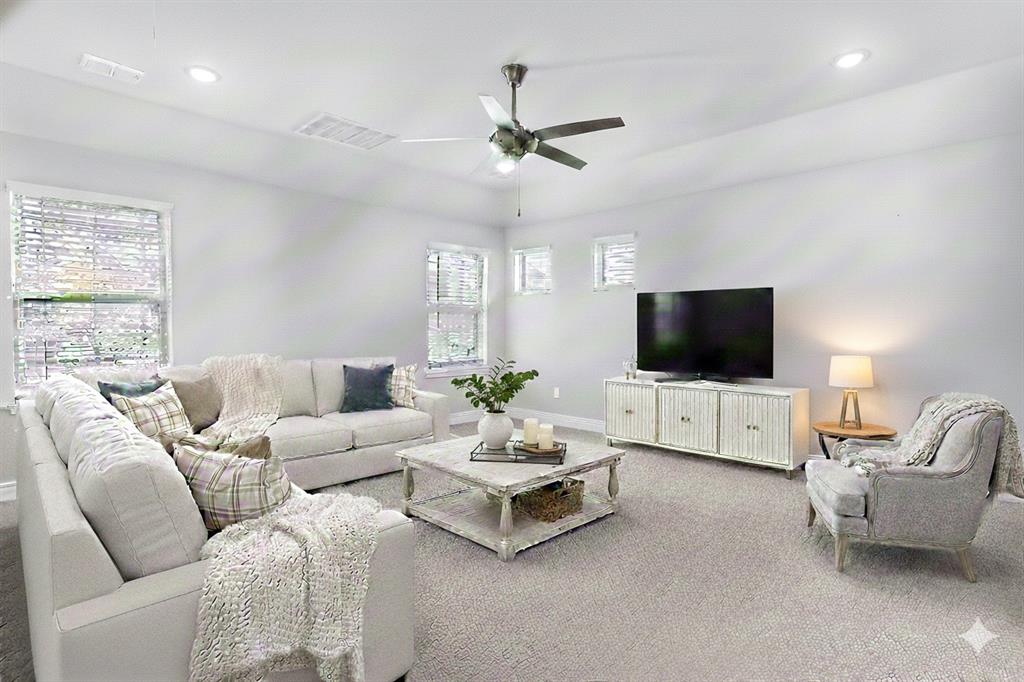 468 Caitlyn Way Fairview, TX 75069 - Photo 10 of 16 a living room with furniture and a flat screen tv