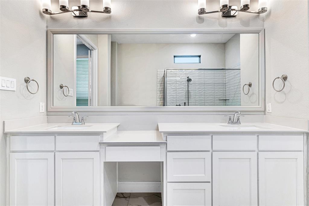468 Caitlyn Way Fairview, TX 75069 - Photo 7 of 16 a bathroom with a sink and a mirror