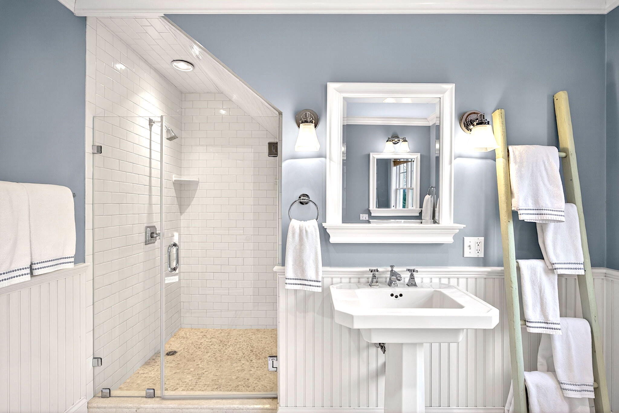 205 Little River Road Cotuit, MA 02635 - Photo 27 of 60 a bathroom with a sink a mirror and a shower