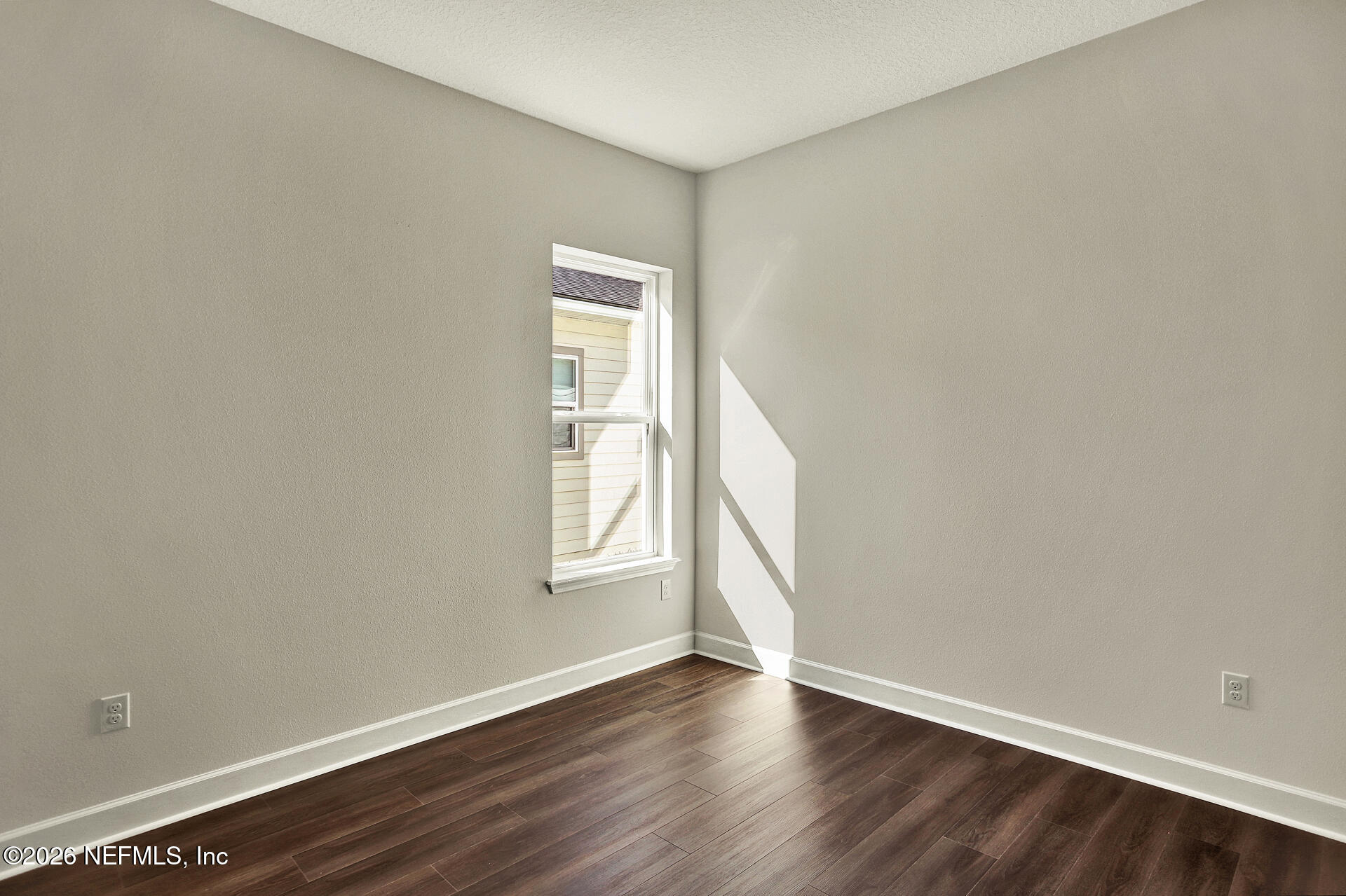 70 Ribera Drive, Unit 323 Flagler Beach, FL 32136 - Photo 3 of 16 an empty room with wooden floor and windows