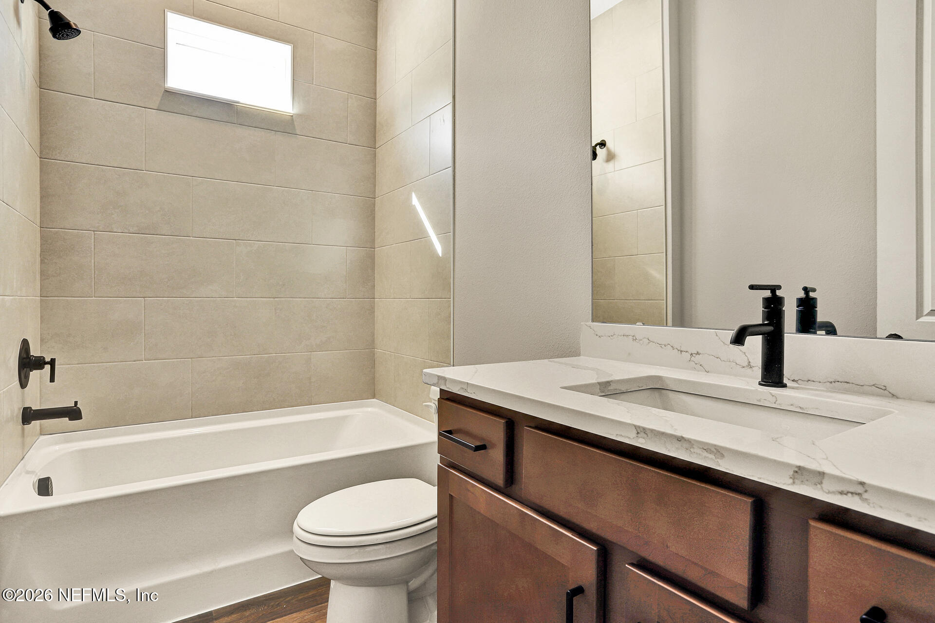 70 Ribera Drive, Unit 323 Flagler Beach, FL 32136 - Photo 5 of 16 a bathroom with a sink a toilet and a bathtub