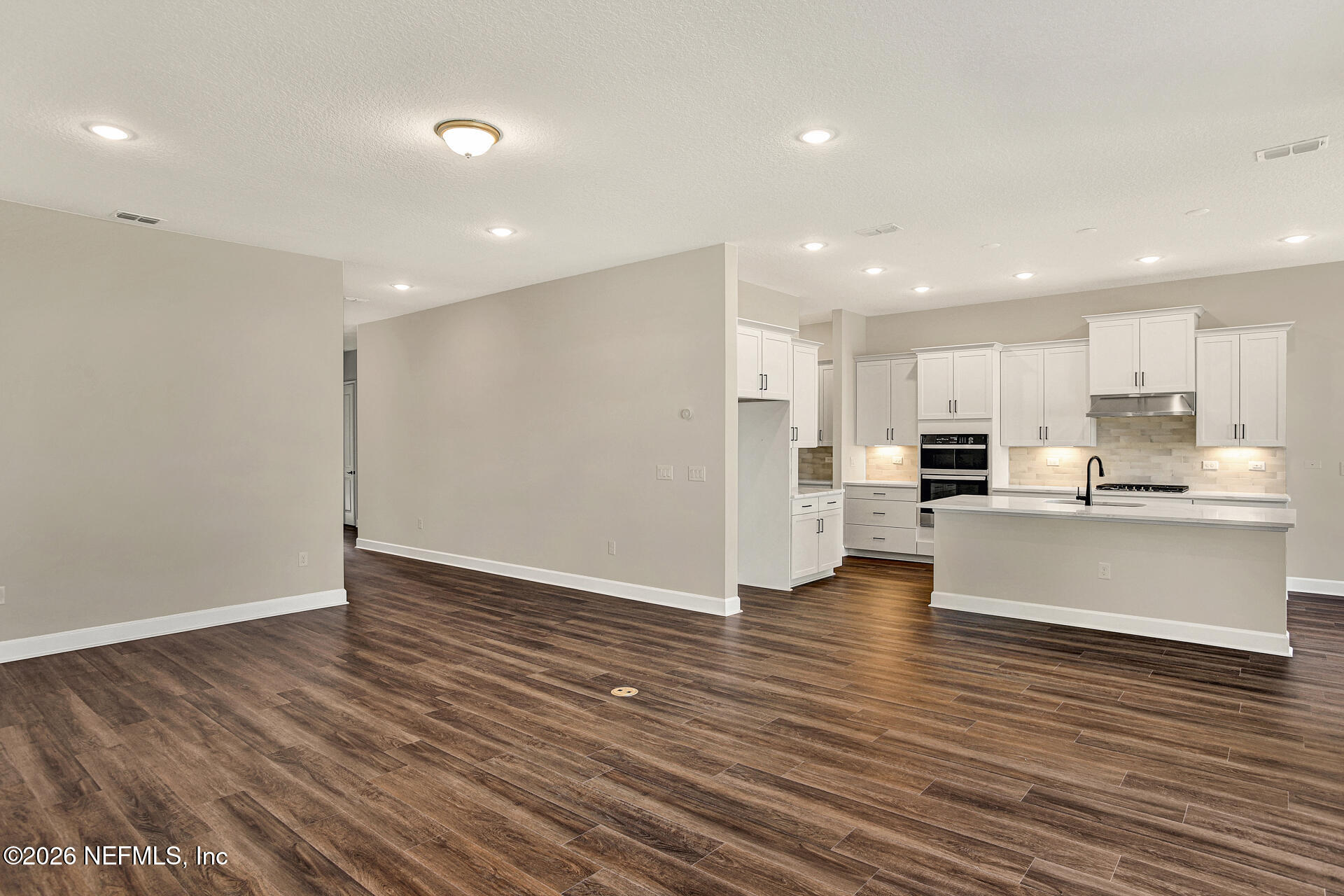 70 Ribera Drive, Unit 323 Flagler Beach, FL 32136 - Photo 8 of 16 a view of kitchen view wooden floors kitchen view and stainless steel appliances