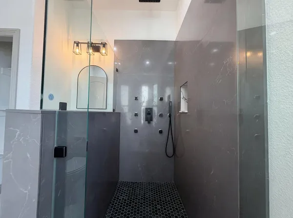 a bathroom with a double vanity sink and mirror
