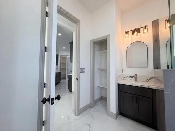 a view of hallway with wooden floor