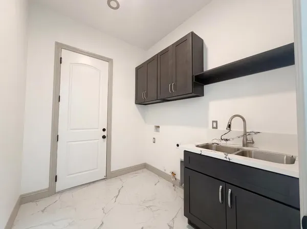 a utility room with cabinets