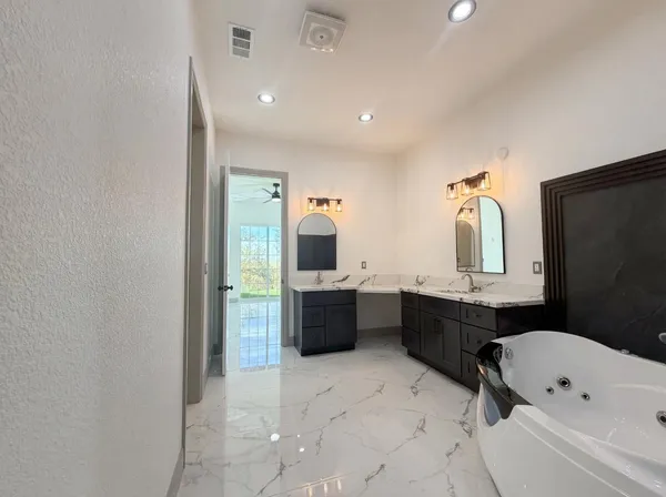 a bathroom with a shower and a sink
