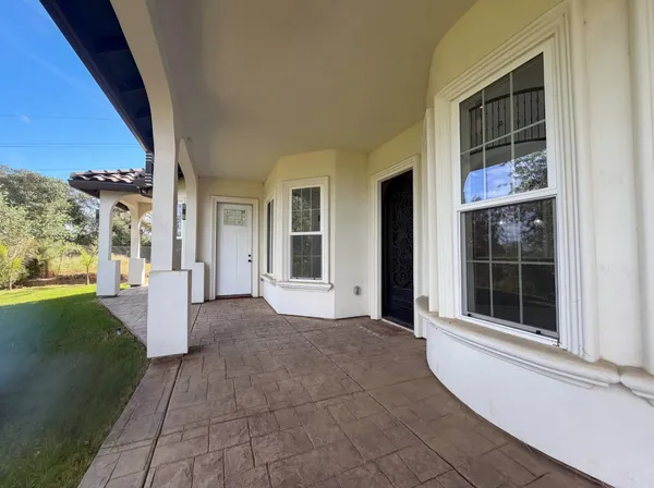 a view of a swimming pool and an outdoor space