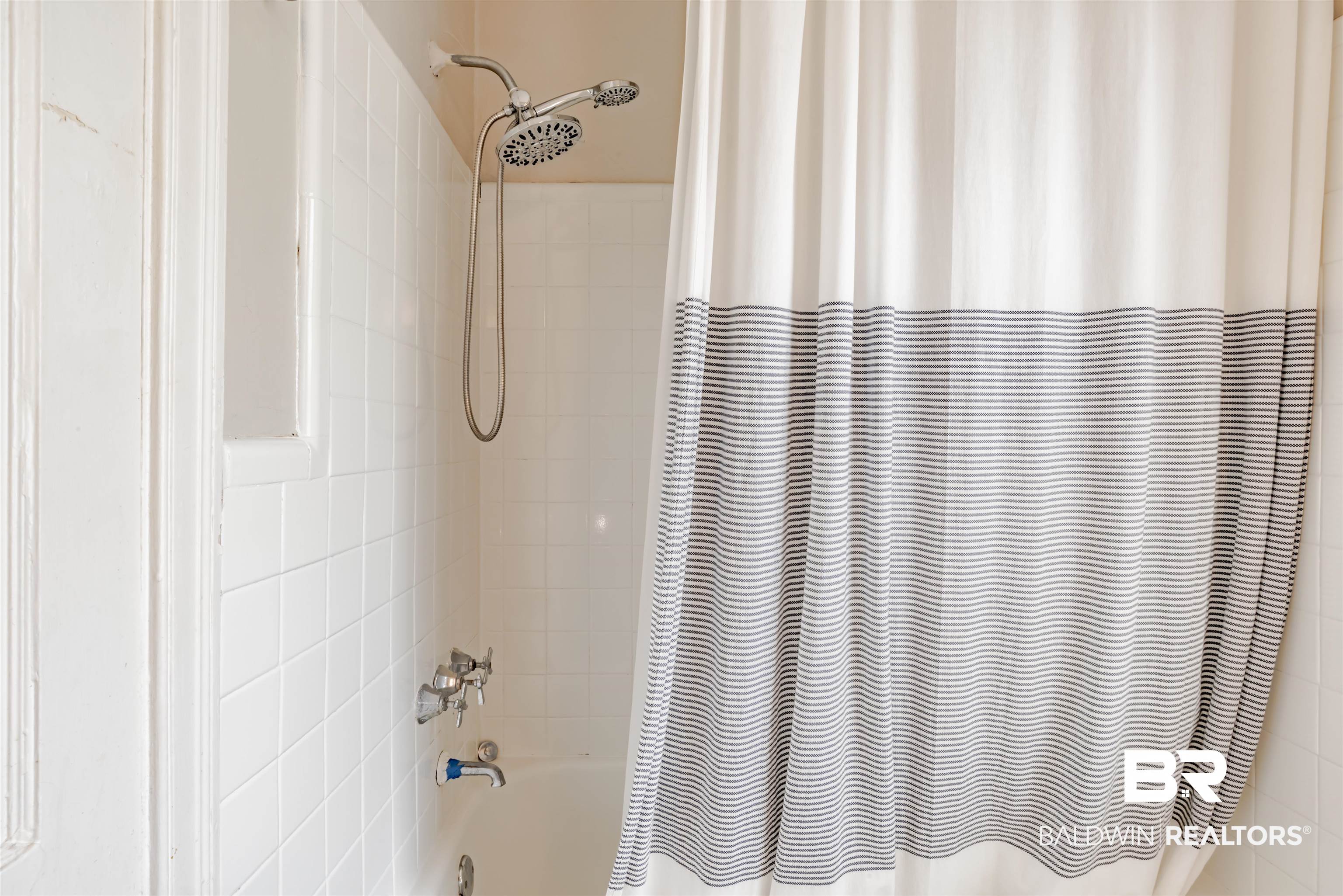 214 Upham Street, Unit 7C Mobile, AL 36607 - Photo 15 of 32 Bathroom view of shower / bath combination with curtain