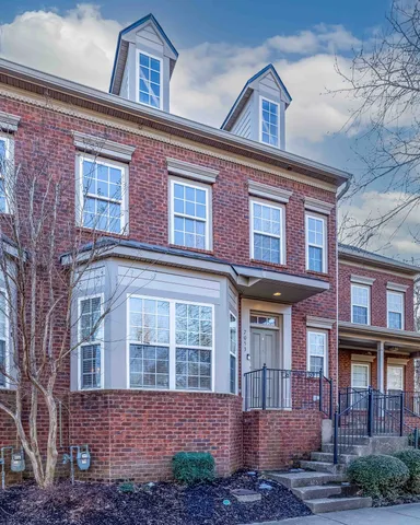 a kitchen with a stove sink and cabinets