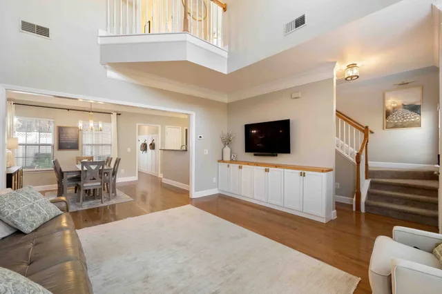 a kitchen with granite countertop a refrigerator and a stove top oven