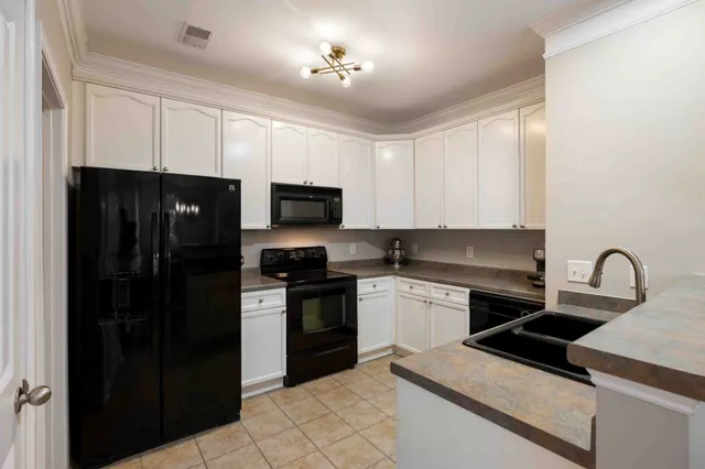 a bathroom with a double vanity sink and a toilet