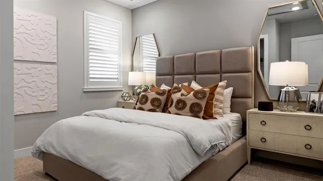 a bedroom with a bed and window