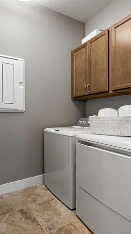 a utility room with washer and dryer