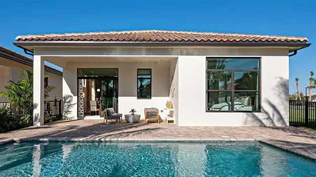 a view of a house with backyard and porch