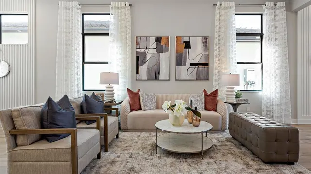 a living room with furniture and a window