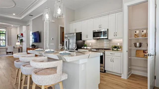 a kitchen with a sink stove and refrigerator