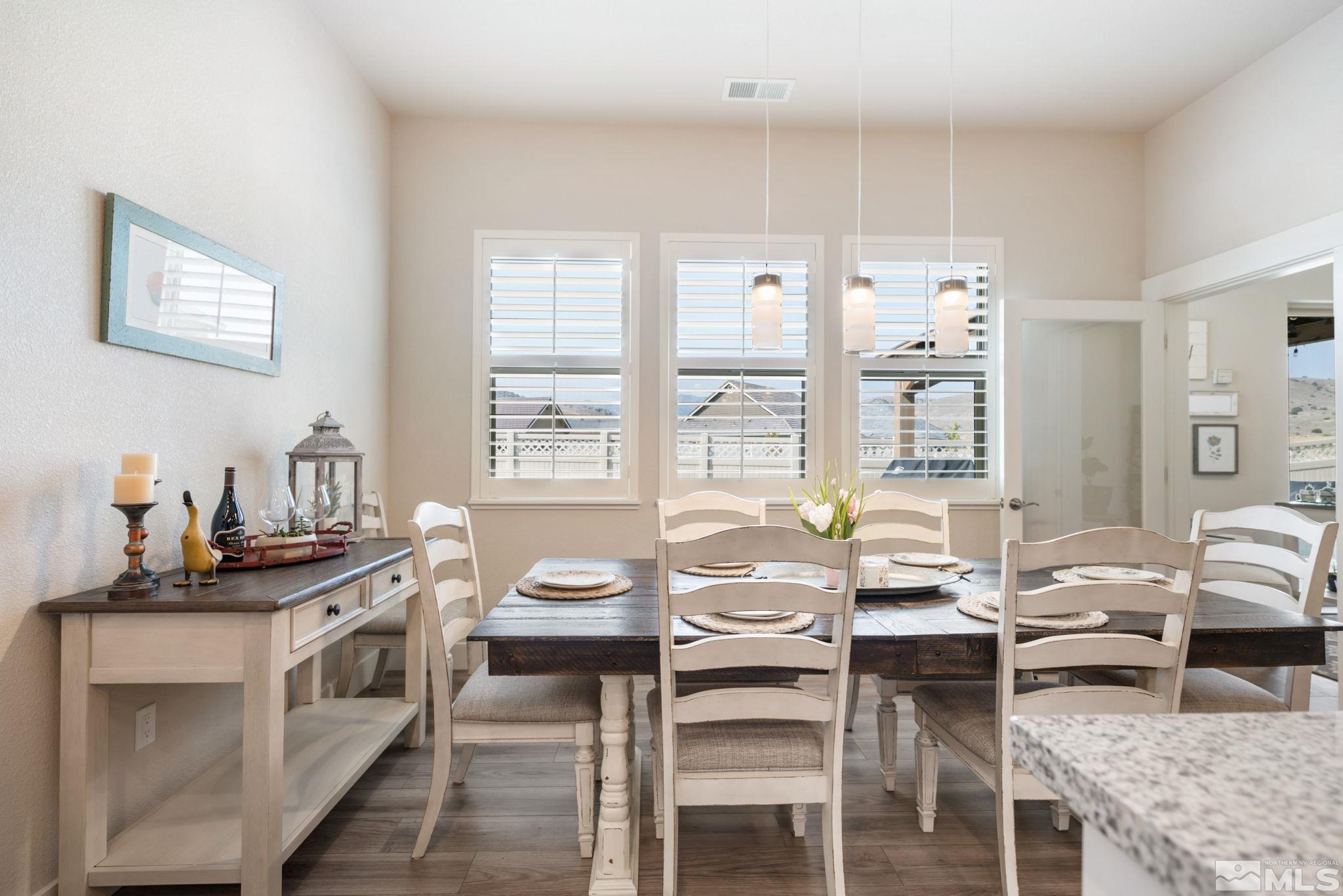 233 Cecina Drive Dayton, NV 89403 - Photo 18 of 39 a kitchen with a stove a table and chairs in it