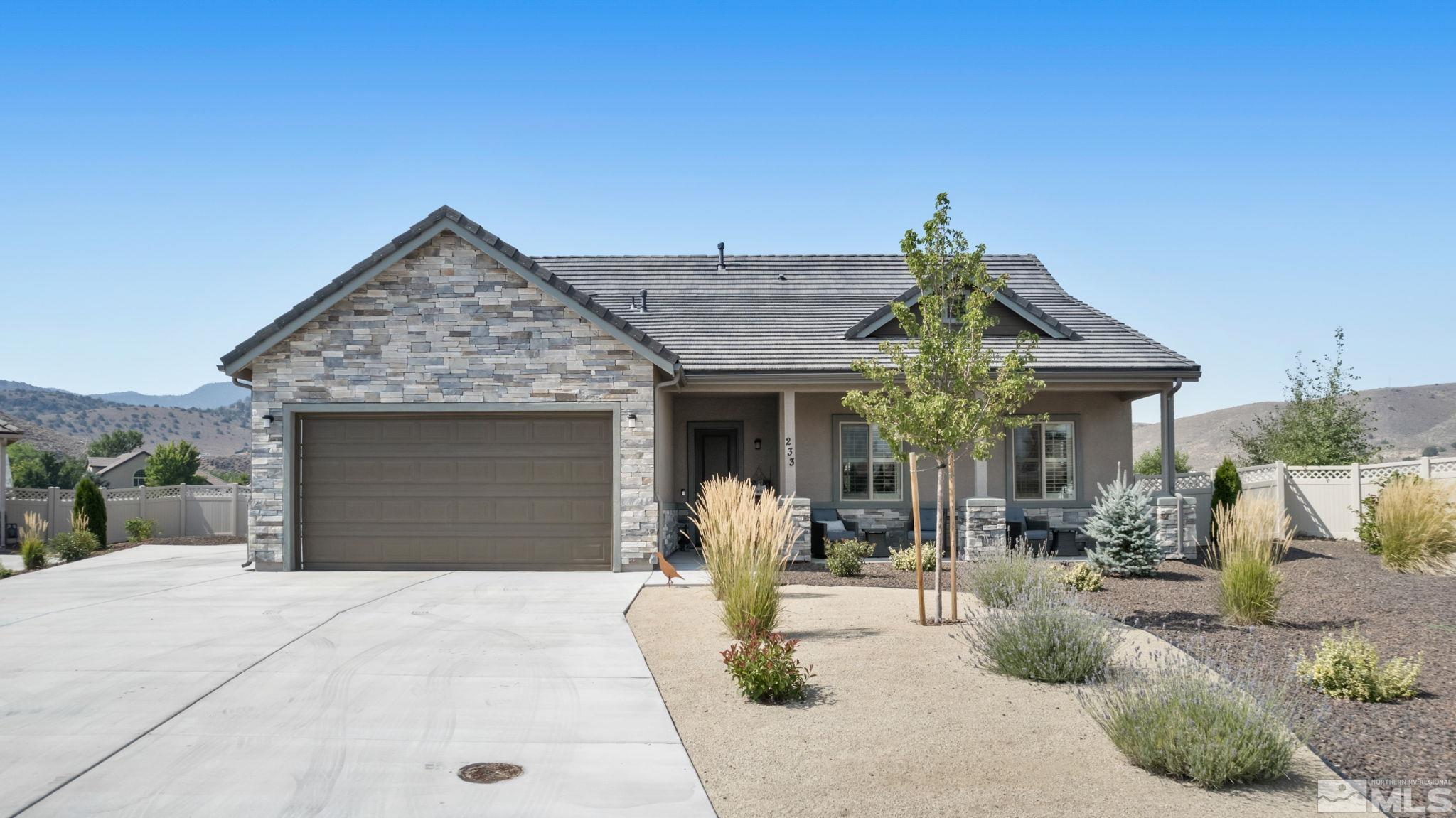 233 Cecina Drive Dayton, NV 89403 - Photo 2 of 39 a view of a house with potted plants