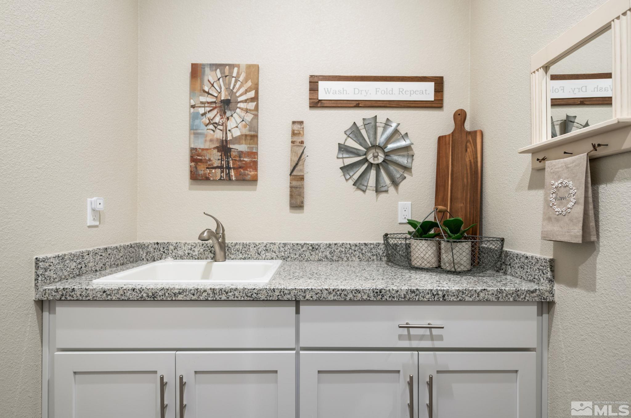 233 Cecina Drive Dayton, NV 89403 - Photo 21 of 39 a bathroom with sink granite and mirror