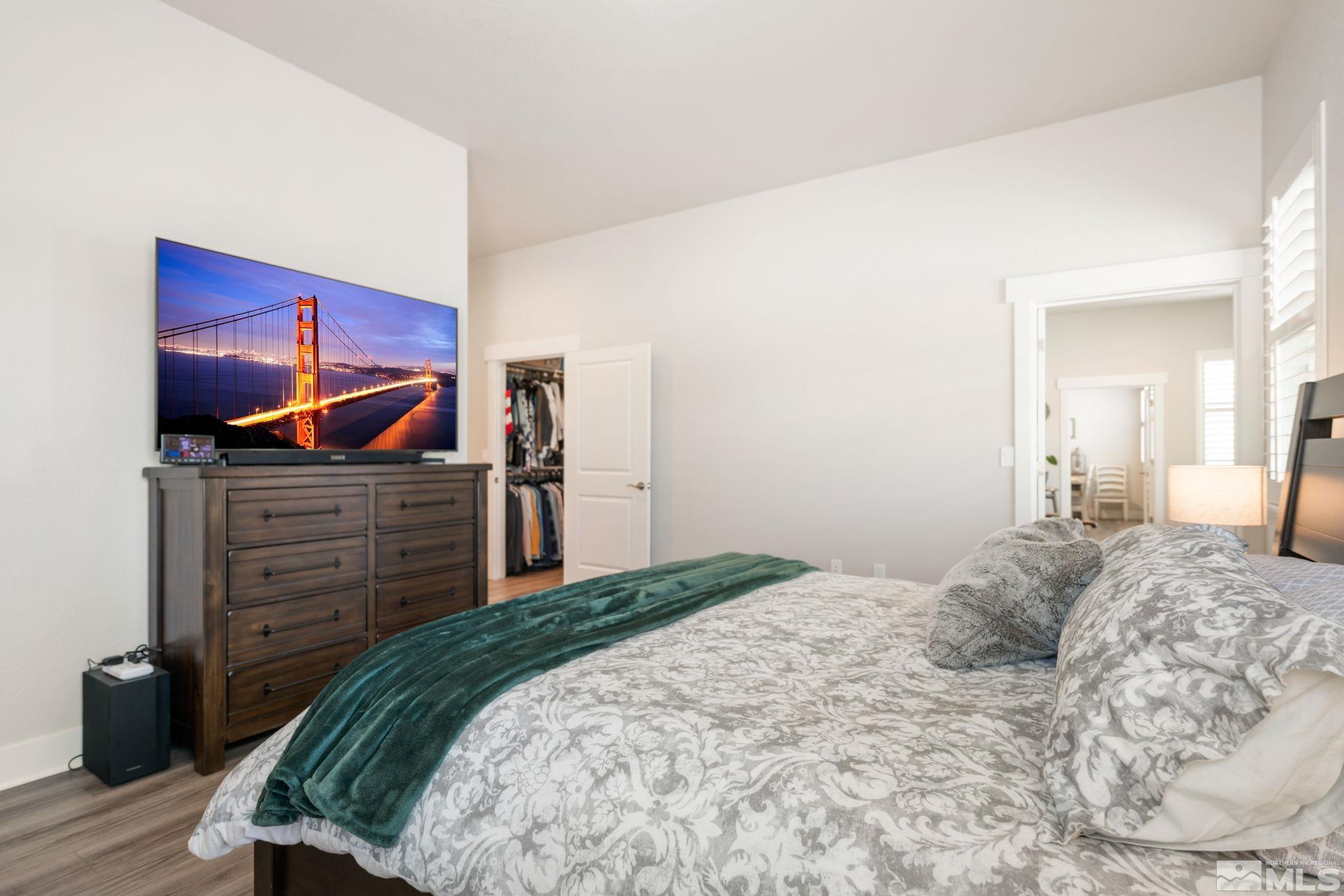 233 Cecina Drive Dayton, NV 89403 - Photo 27 of 39 a bedroom with a bed and furniture