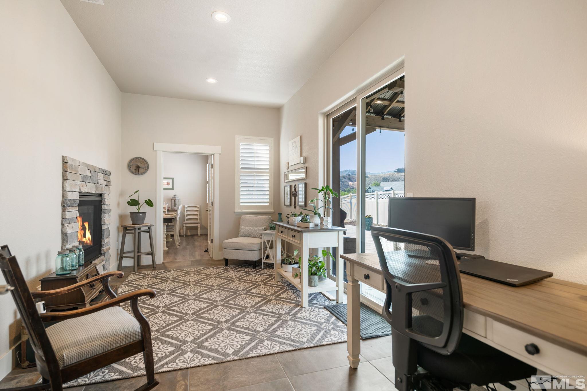 233 Cecina Drive Dayton, NV 89403 - Photo 28 of 39 a living room with furniture a flat screen tv and large windows