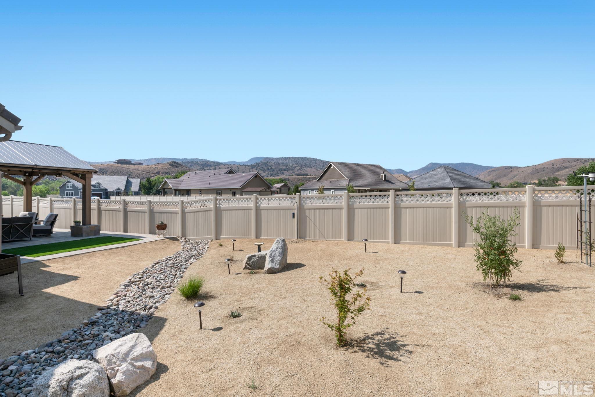 233 Cecina Drive Dayton, NV 89403 - Photo 34 of 39 a view of a house with backyard and a sitting area