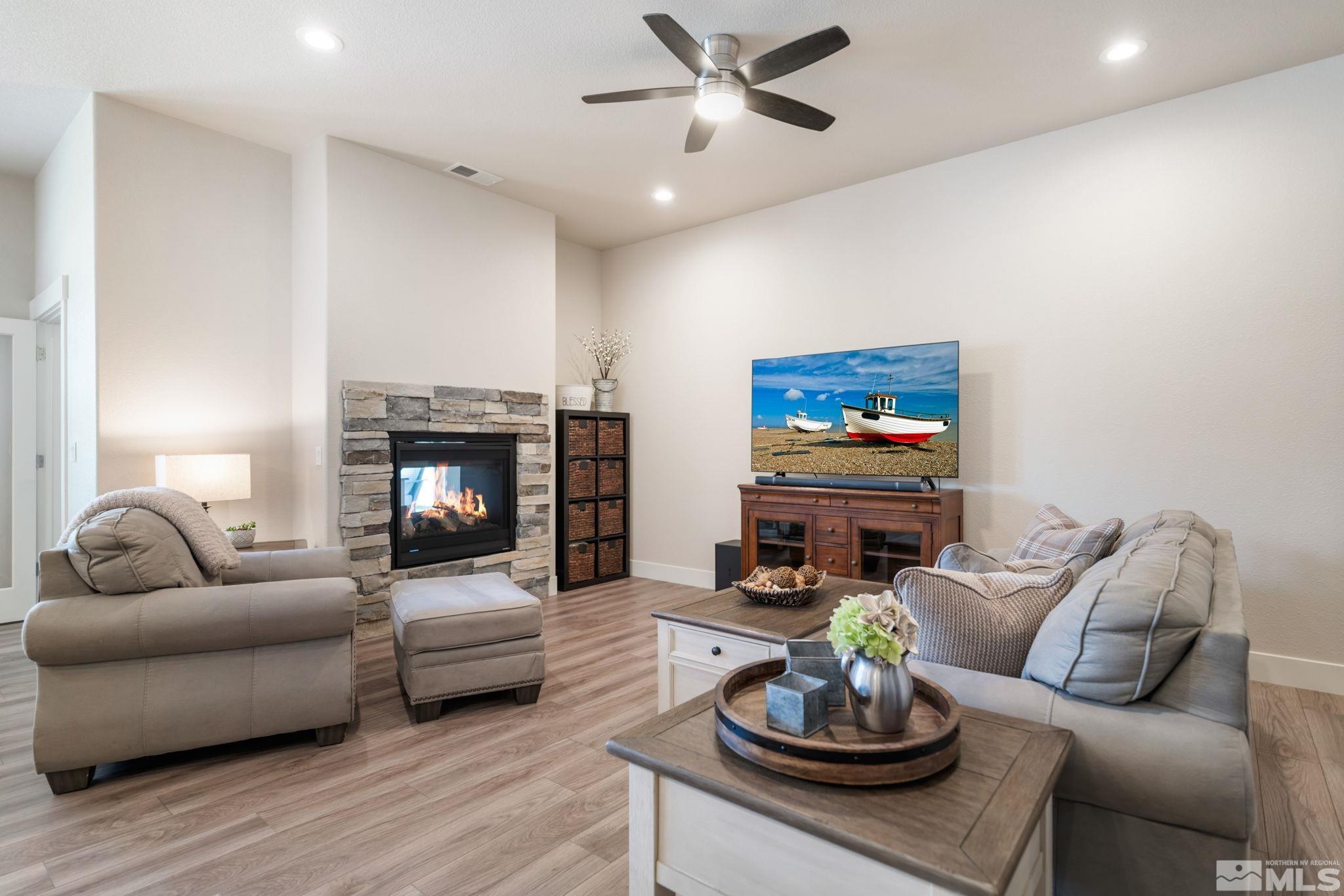 233 Cecina Drive Dayton, NV 89403 - Photo 10 of 39 a living room with furniture and a fireplace