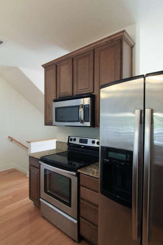 13420 Lyndhurst Street, Unit 401 408 303 Austin, TX 78717 - Photo 17 of 36 a kitchen with a stove and a microwave
