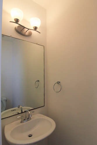 13420 Lyndhurst Street, Unit 401 408 303 Austin, TX 78717 - Photo 23 of 36 a bathroom with a sink and mirror