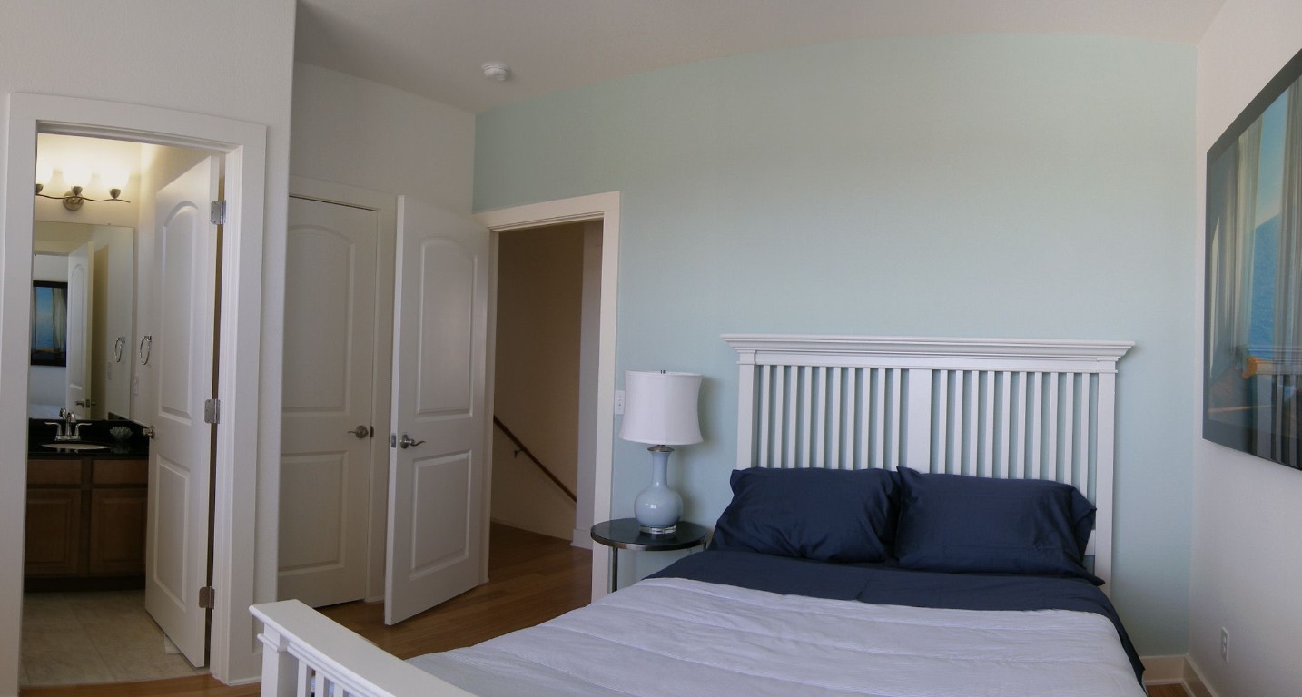 13420 Lyndhurst Street, Unit 401 408 303 Austin, TX 78717 - Photo 26 of 36 a bedroom with a bed and wooden floor