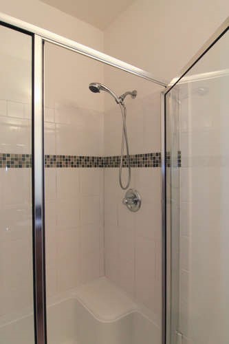 13420 Lyndhurst Street, Unit 401 408 303 Austin, TX 78717 - Photo 33 of 36 a bathroom with a shower and a glass door