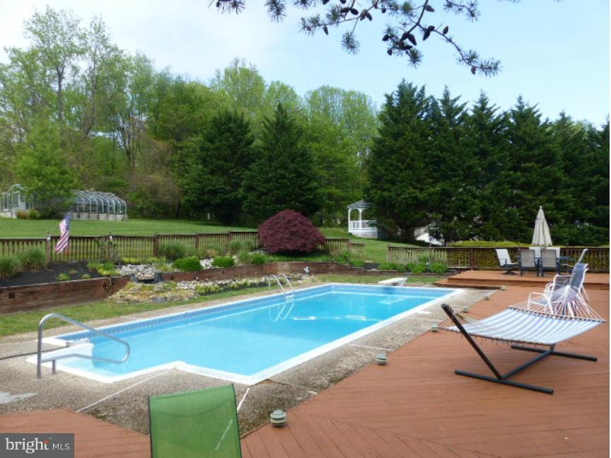 3004 Merrymans Mill Road Phoenix, MD 21131 - Photo 24 of 29 a view of a swimming pool and lounge chairs in back yard
