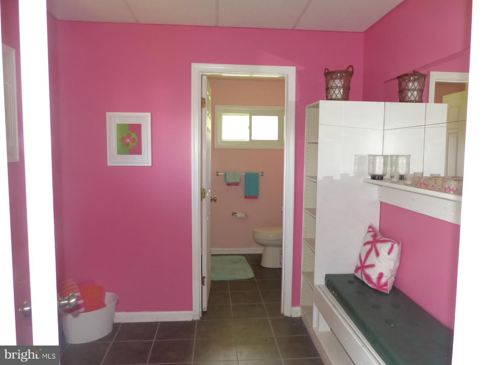 3004 Merrymans Mill Road Phoenix, MD 21131 - Photo 29 of 29 a bathroom with a sink mirror vanity and toilet